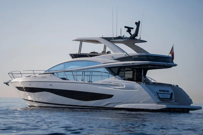 Masie Yacht Photos Pics 2023 Pearl 62 yacht cruising on calm ocean waters.