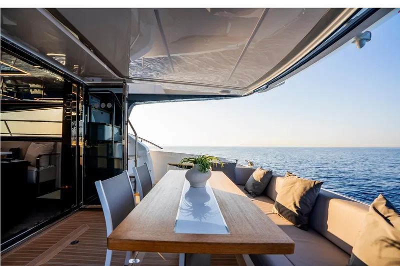 Masie Yacht Photos Pics Luxurious Pearl 62 yacht deck with elegant seating, ocean view, and modern design, 2023 model.