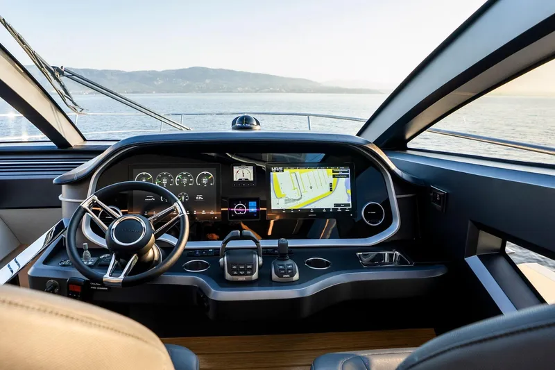 Masie Yacht Photos Pics Luxurious 2023 Pearl 62 yacht cockpit with advanced navigation system and scenic ocean view.