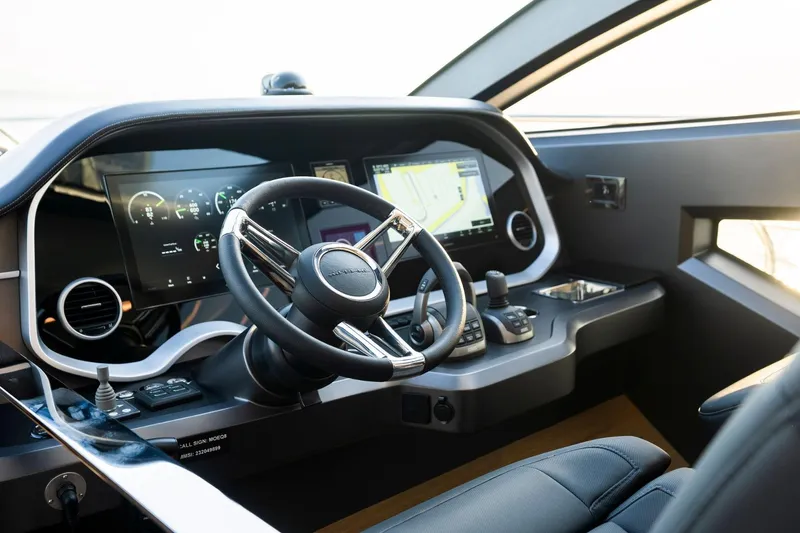 Masie Yacht Photos Pics Modern helm of 2023 Pearl 62 yacht with advanced navigation displays and controls.