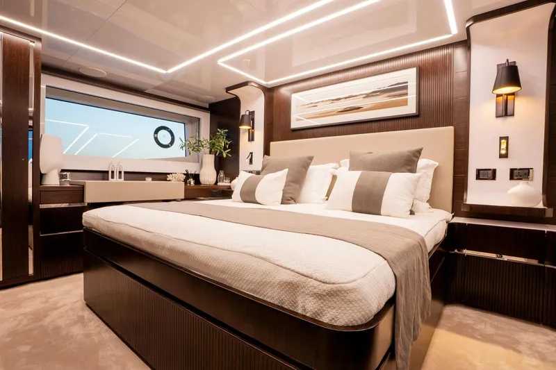 Masie Yacht Photos Pics Luxurious 2023 Pearl 62 yacht bedroom with modern decor and ambient lighting.