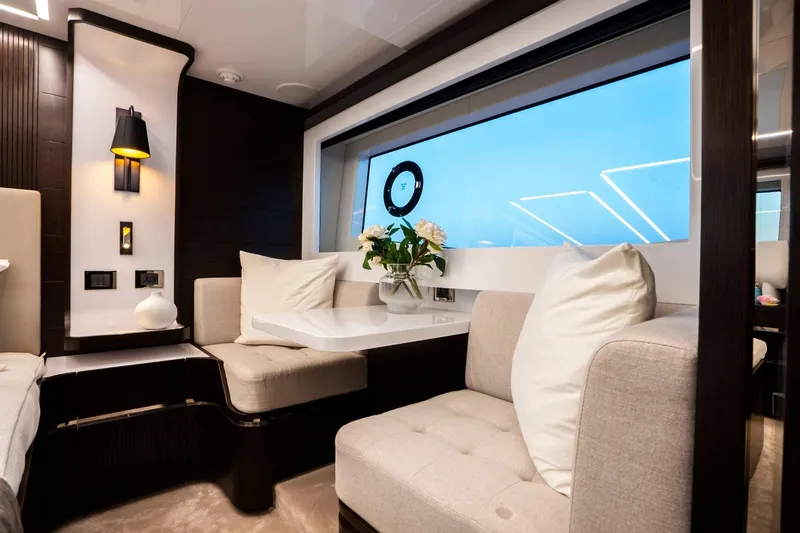 Masie Yacht Photos Pics Luxurious interior of 2023 Pearl 62 yacht with elegant seating and modern decor.