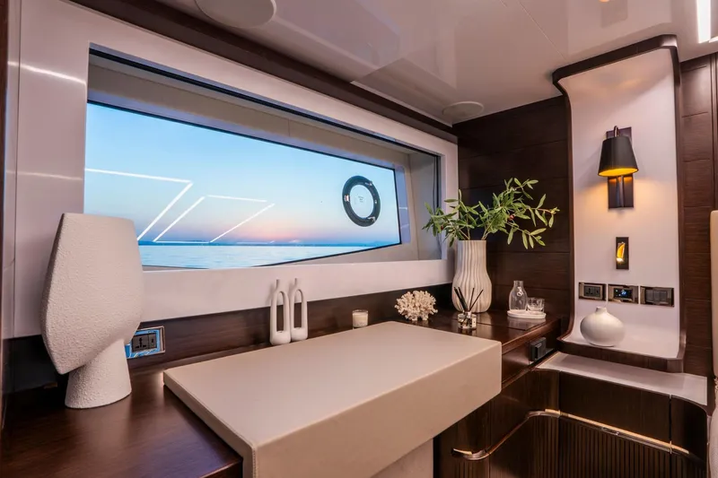 Masie Yacht Photos Pics Luxurious interior of 2023 Pearl 62 yacht with elegant decor and ocean view.