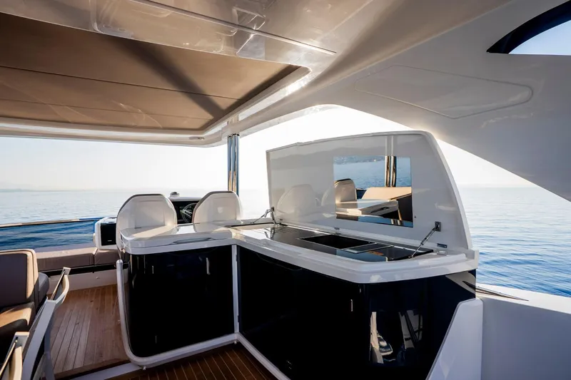 Masie Yacht Photos Pics Luxurious 2023 Pearl 62 yacht interior with modern design and ocean view.