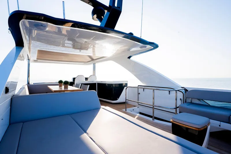 Masie Yacht Photos Pics Luxurious 2023 Pearl 62 yacht deck with modern seating and ocean view.