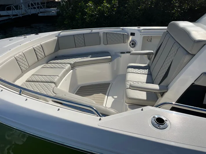  Yacht Photos Pics Luxurious seating on 2024 Pursuit 358 SPORT boat, featuring elegant quilted upholstery.