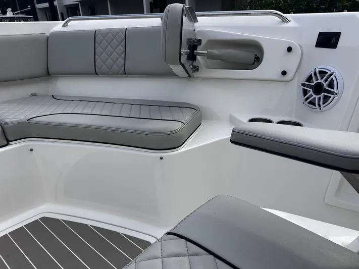  Yacht Photos Pics 2024 Pursuit 358 SPORT boat interior with gray seating and speaker.