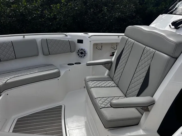  Yacht Photos Pics Luxurious seating on 2024 Pursuit 358 SPORT boat with quilted upholstery and cup holders.