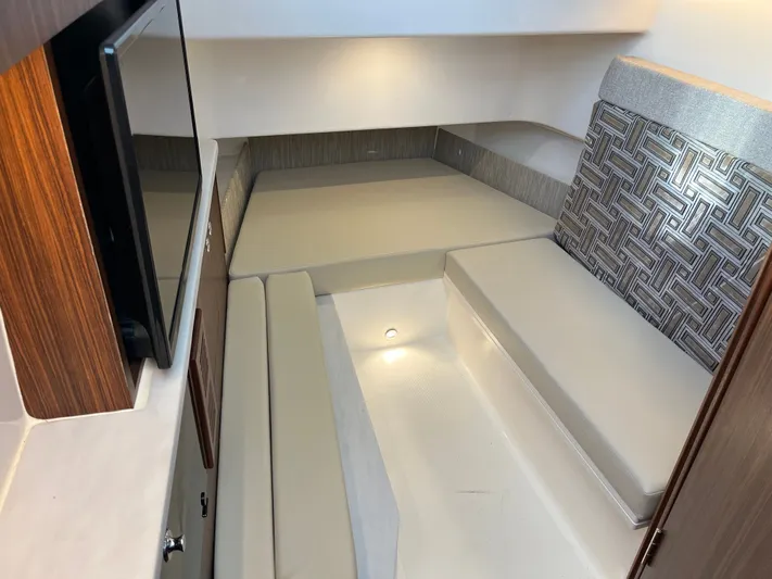  Yacht Photos Pics 2024 Pursuit 358 SPORT cabin interior with modern seating and ambient lighting.