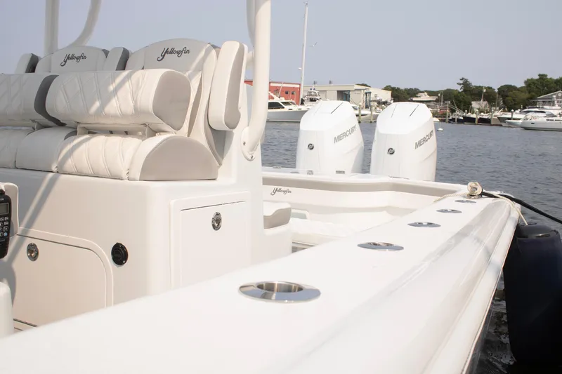  Yacht Photos Pics 2025 Yellowfin 32 Offshore boat with dual Mercury engines docked at marina.