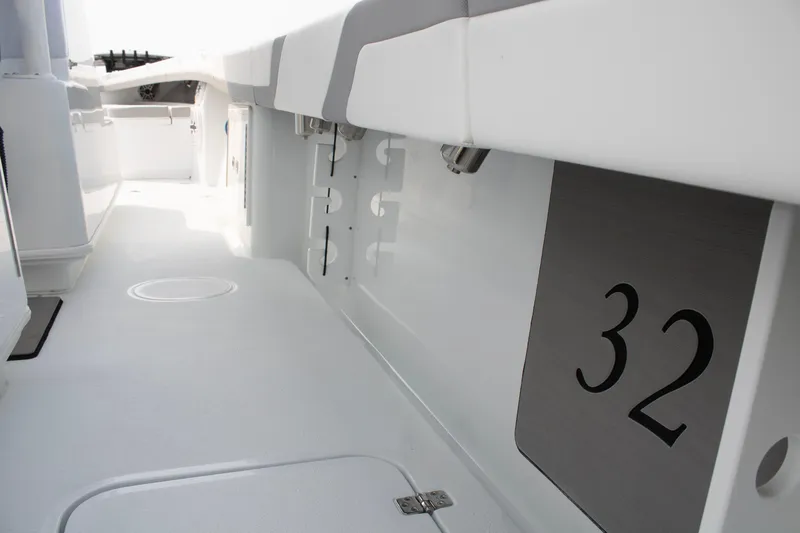  Yacht Photos Pics 2025 Yellowfin 32 Offshore boat interior, showcasing sleek white design and spacious layout.