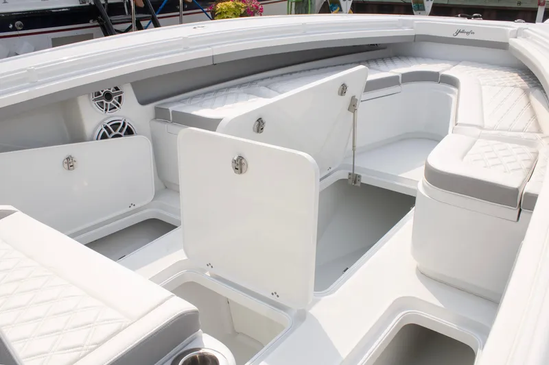  Yacht Photos Pics 2025 Yellowfin 32 Offshore boat interior with open storage compartments and cushioned seating.