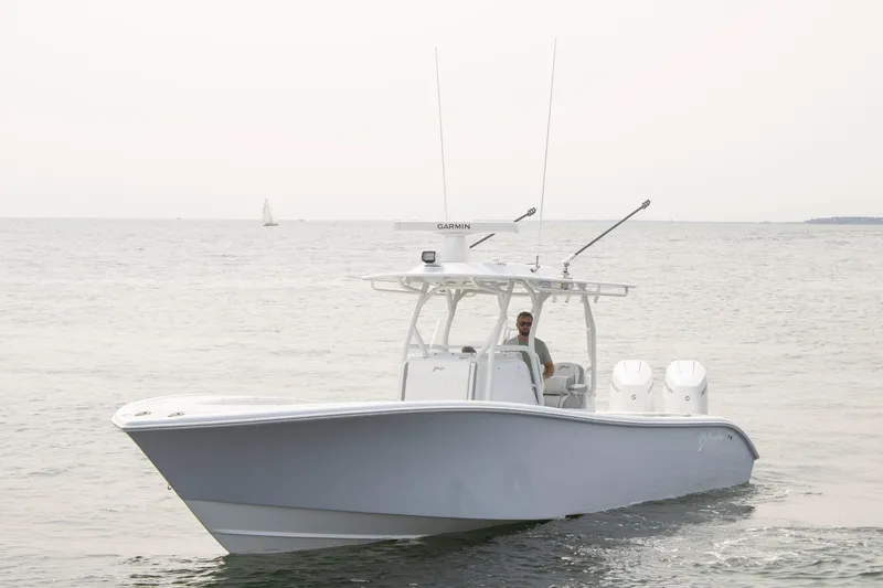  Yacht Photos Pics 2025 Yellowfin 32 Offshore boat cruising on open water.