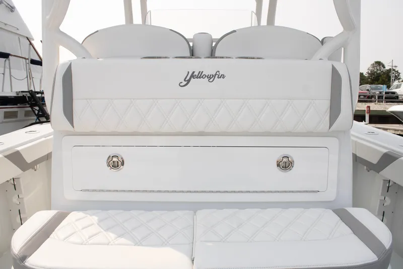  Yacht Photos Pics 2025 Yellowfin 32 Offshore boat interior with white cushioned seating.