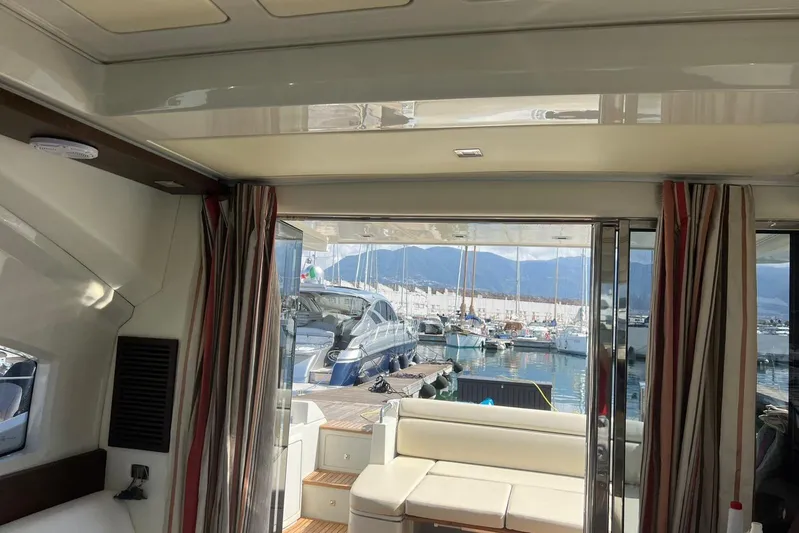  Yacht Photos Pics Interior view of 2008 Azimut 43S yacht with marina backdrop.