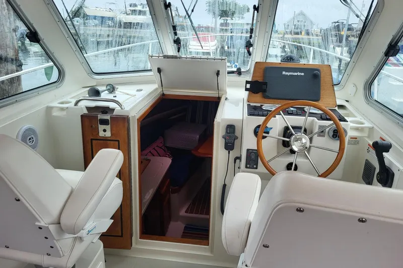  Yacht Photos Pics 2008 Back Cove 29 boat interior with helm, steering wheel, and cabin entrance.