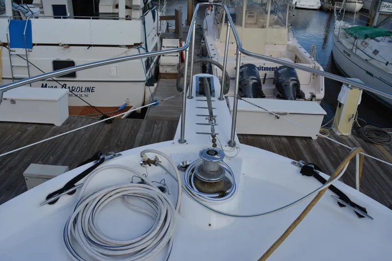 Lady Laura Yacht Photos Pics 1989 Viking Motor Yacht docked, featuring deck equipment and marina view.