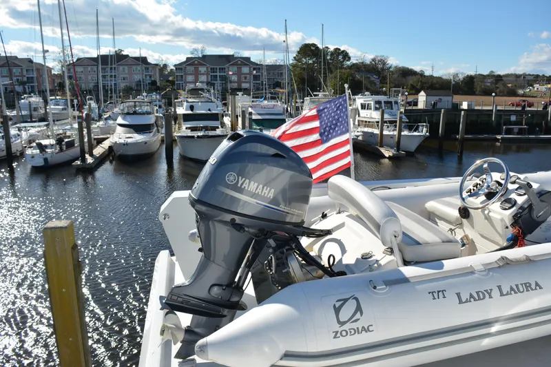Lady Laura Yacht Photos Pics 1989 Viking Motor Yacht docked with Yamaha engine and American flag.