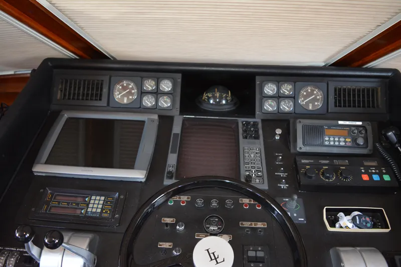 Lady Laura Yacht Photos Pics Control panel of a 1989 Viking Motor Yacht with navigation instruments and gauges.
