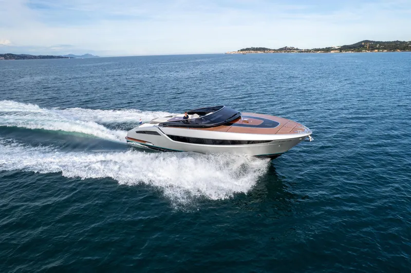  Yacht Photos Pics 2019 Riva Dolceriva 48 yacht cruising on open sea, showcasing sleek design and luxury.