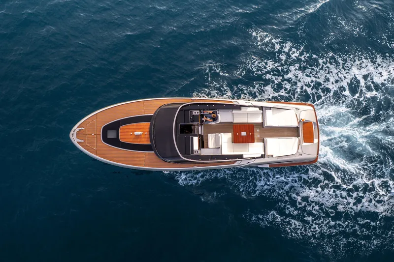  Yacht Photos Pics Aerial view of 2019 Riva Dolceriva 48 yacht cruising on open water.
