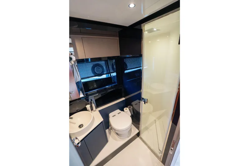  Yacht Photos Pics Luxurious bathroom in 2019 Riva Dolceriva 48 yacht with modern fixtures and sleek design.