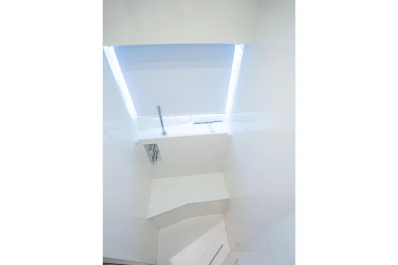  Yacht Photos Pics Interior view of 2019 Riva Dolceriva 48 yacht, featuring sleek white design and modern lighting.