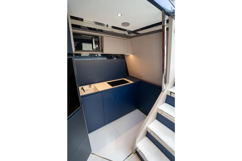  Yacht Photos Pics Luxurious interior of 2019 Riva Dolceriva 48 yacht, featuring modern kitchen design.