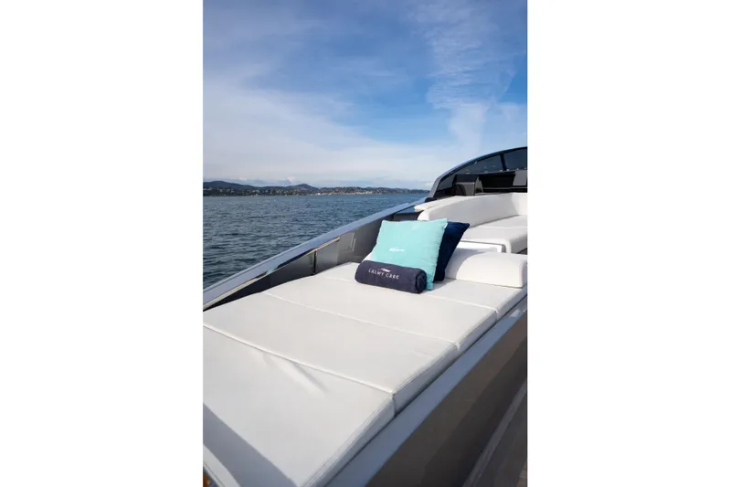  Yacht Photos Pics Luxurious 2019 Riva Dolceriva 48 yacht with elegant deck seating on calm waters.