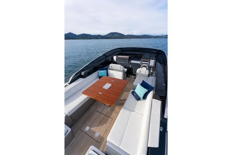  Yacht Photos Pics Luxurious 2019 Riva Dolceriva 48 yacht interior with elegant seating and wooden table.