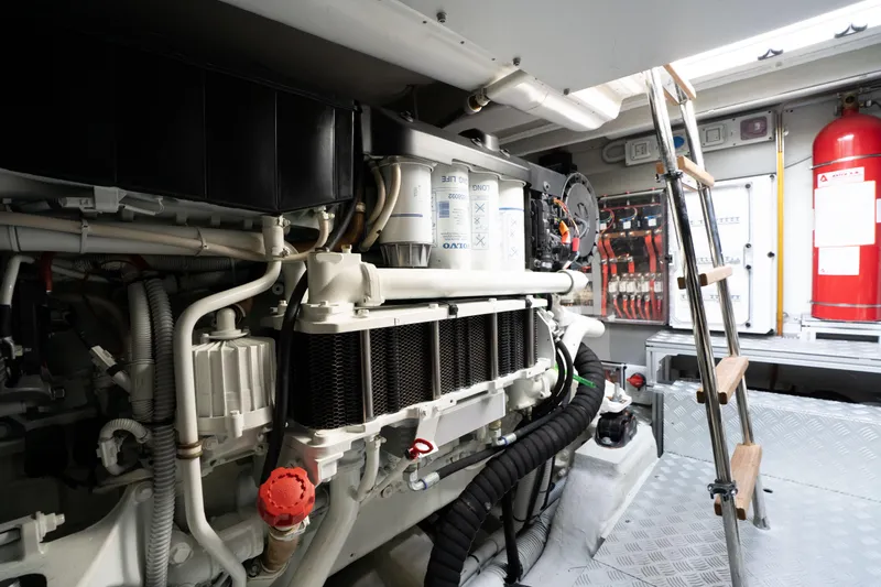  Yacht Photos Pics Engine room of 2019 Riva Dolceriva 48 yacht, featuring mechanical components and ladder.