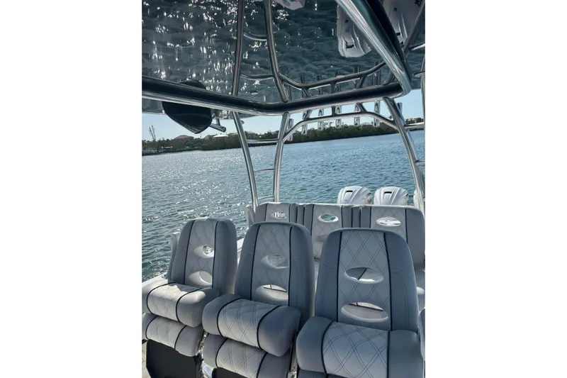  Yacht Photos Pics 2025 Contender 39 ST boat interior with luxurious seating on a sunny day.