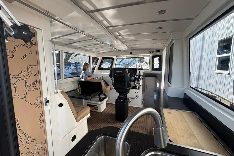  Yacht Photos Pics Interior of 2025 Custom JR Marine 33 Savage boat with modern design and seating.