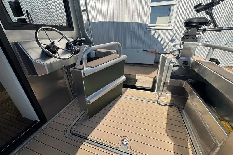  Yacht Photos Pics Modern helm of 2025 Custom JR Marine 33 Savage boat with sleek design and controls.