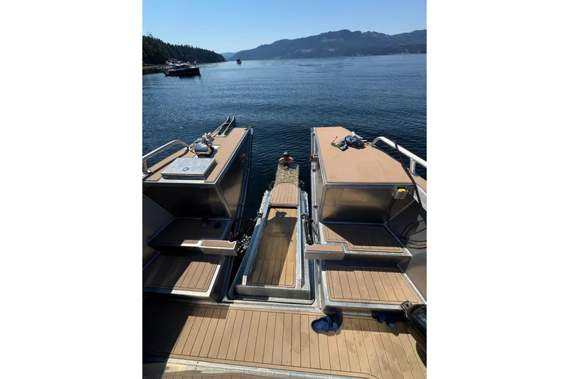  Yacht Photos Pics 2025 JR Marine 33 Savage boat on serene lake with scenic mountain backdrop.