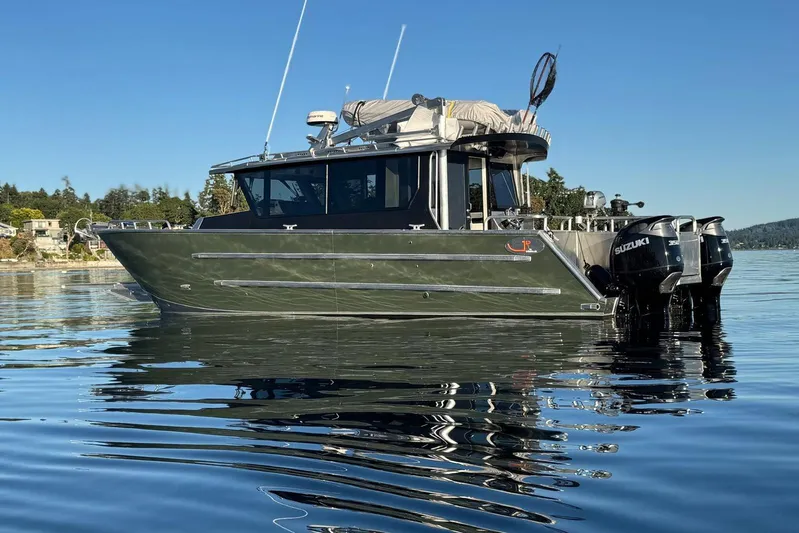  Yacht Photos Pics 2025 JR Marine 33 Savage boat on calm water, featuring dual Suzuki engines.
