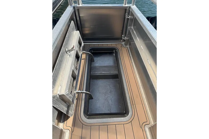  Yacht Photos Pics 2025 JR Marine 33 Savage boat interior with open storage compartment, featuring sleek metal design.
