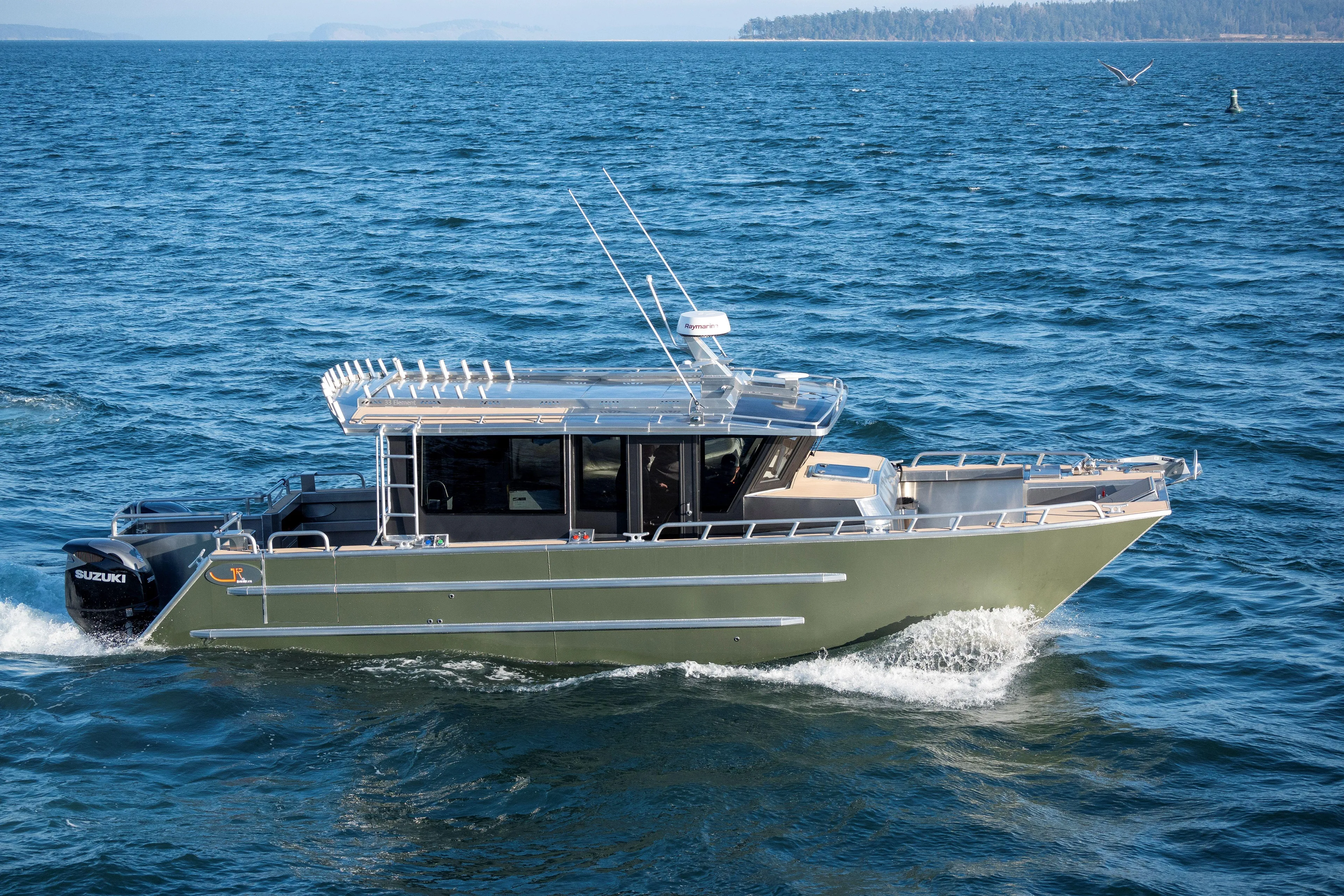  Yacht Photos Pics 2025 JR Marine 33 Savage boat cruising on open water.