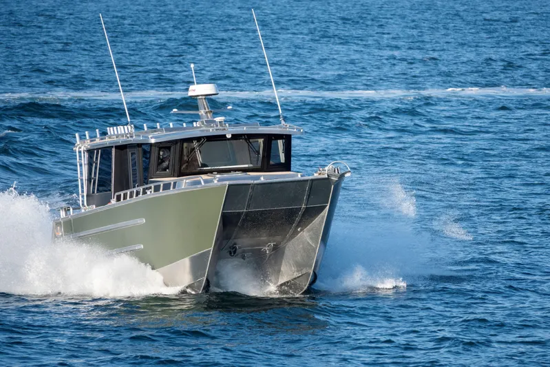  Yacht Photos Pics JR Marine 33 Savage 2025 boat navigating through ocean waves.