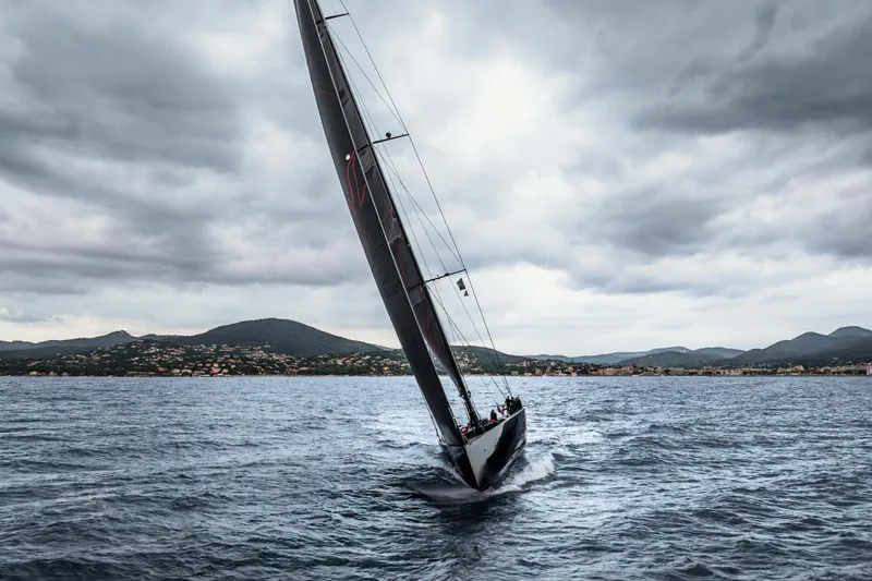 Black Sails Yacht Photos Pics Sailing yacht Wally 130 from 2009 navigating choppy waters under cloudy skies.