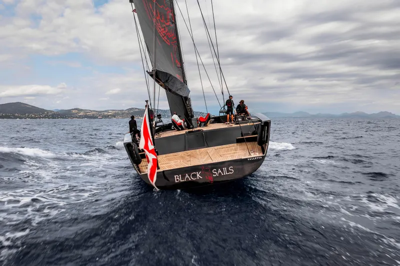 Black Sails Yacht Photos Pics Sailing yacht Wally 130, 2009 model, navigating open sea under cloudy skies.