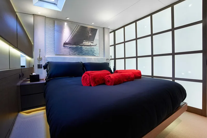 Black Sails Yacht Photos Pics Luxurious bedroom on 2009 Wally 130 yacht with modern decor and red accents.
