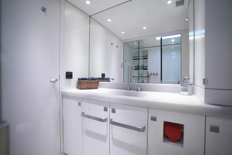 Black Sails Yacht Photos Pics Luxurious bathroom interior on 2009 Wally 130 yacht, featuring sleek white design and modern fixtures.