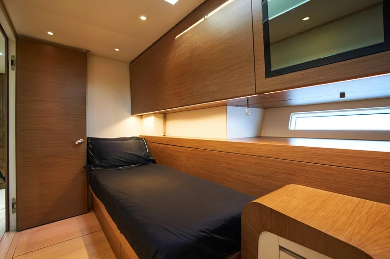 Black Sails Yacht Photos Pics Luxurious cabin interior of 2009 Wally 130 yacht with sleek wood finish and modern design.
