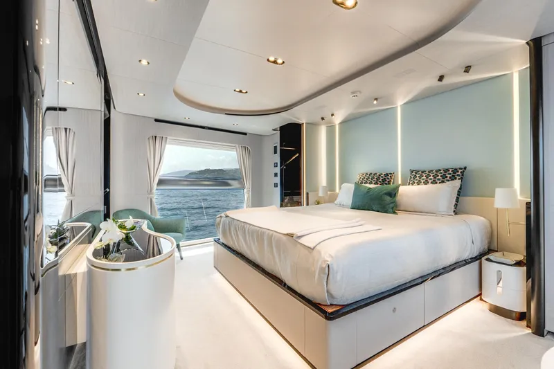  Yacht Photos Pics Luxurious bedroom interior of 2019 Azimut 27 Metri yacht with ocean view.
