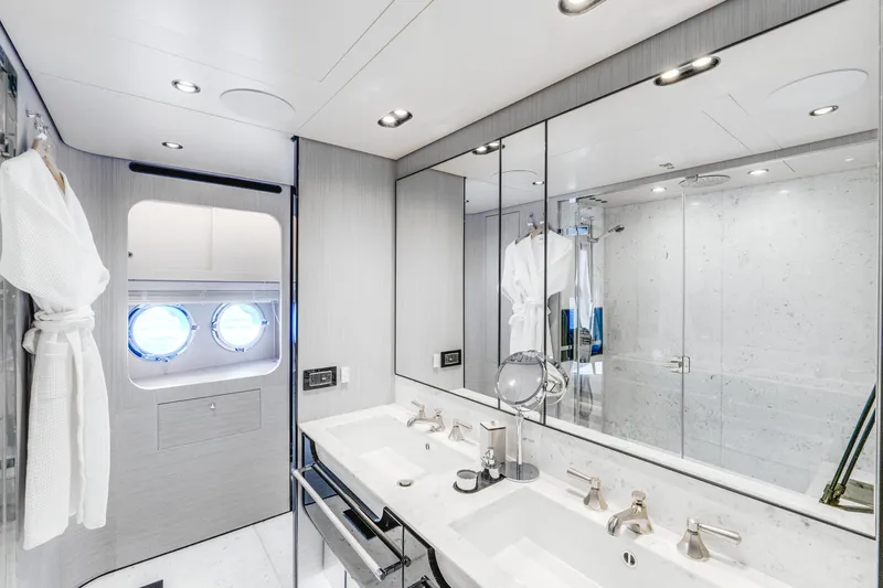  Yacht Photos Pics Luxurious bathroom on 2019 Azimut 27 Metri yacht with double sinks and modern fixtures.