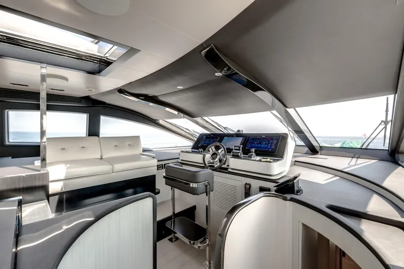 Yacht Photos Pics Luxurious interior of 2019 Azimut 27 Metri yacht with modern helm and seating.
