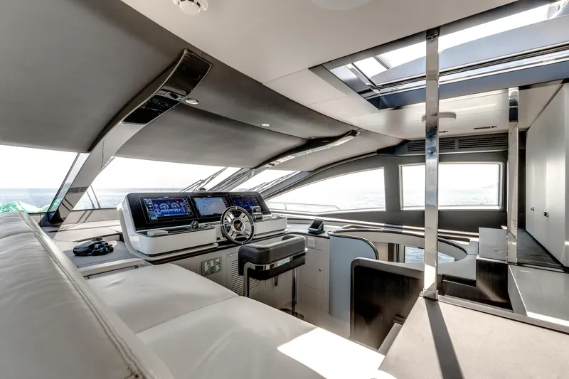  Yacht Photos Pics Luxurious interior of 2019 Azimut 27 Metri yacht with modern helm and panoramic windows.