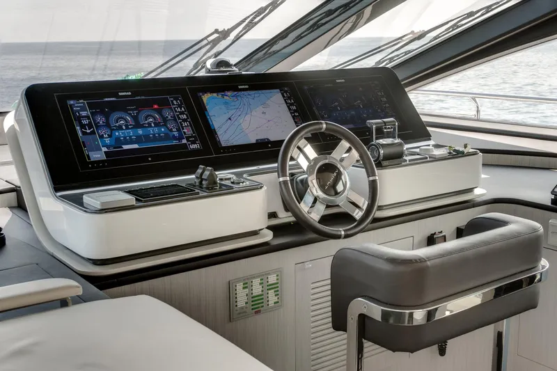  Yacht Photos Pics Modern helm of 2019 Azimut 27 Metri yacht with advanced navigation displays.