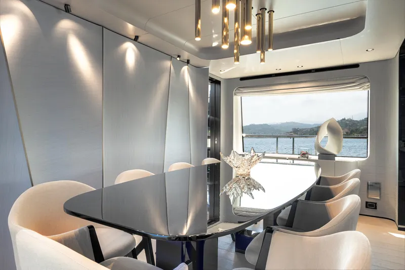  Yacht Photos Pics Luxurious dining area on 2019 Azimut 27 Metri yacht with elegant decor and sea view.